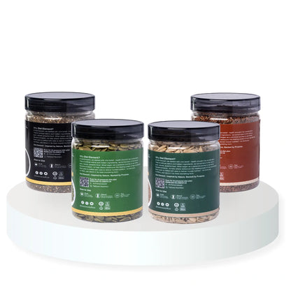 Four jars of different sizes with black lids on a white background